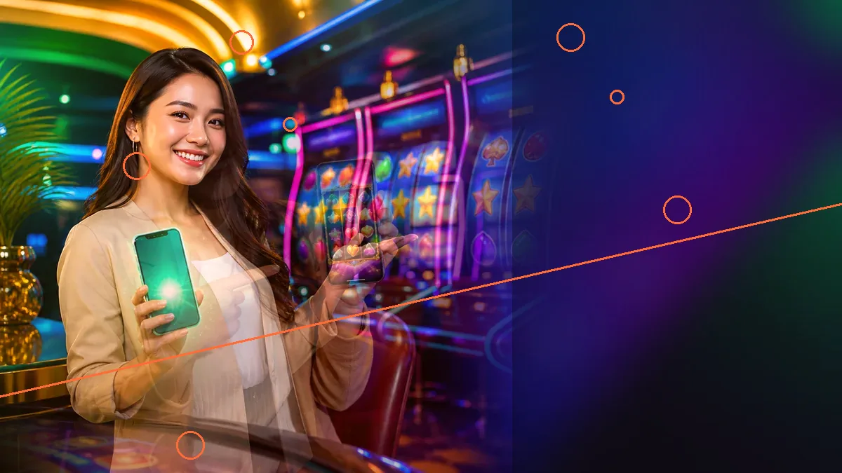 An adult woman holding a glowing smartphone beside casino machines — L444 guide